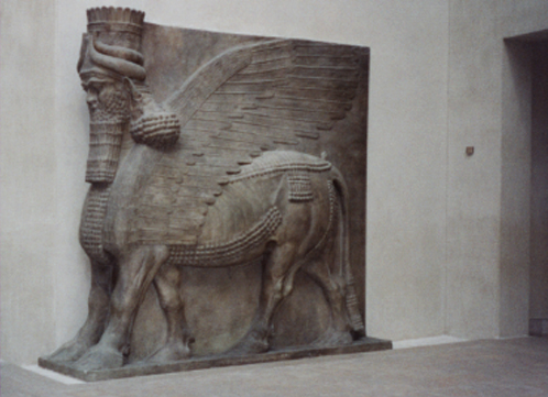 Assyrian winged bull man, 13' 10" tall. || Louvre, Paris.